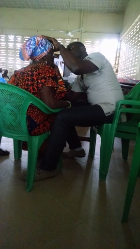 Ernest conducting an assessment on one of the day's 250 patients
